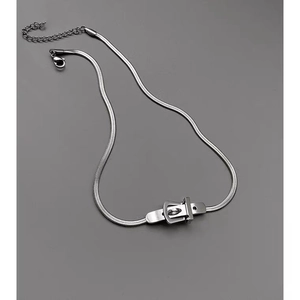 Close-up of silver snake chain necklace featuring a creative belt buckle pendant design