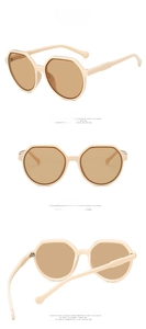 Detail view of retro beige sunglasses with tea lenses and non-slip temple tips