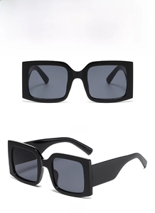 Front and 45-degree side view of oversized square black sunglasses with wide temples