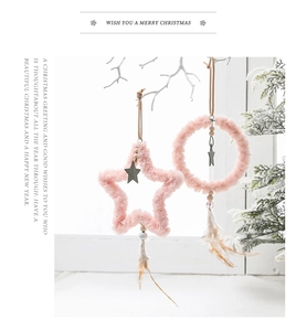 Pink plush star and round Christmas ornaments with wooden beads and feather tassels