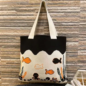 Handmade knitted tote bag with ocean theme octopus and fish patterns in black and white