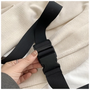 Detail of durable black nylon strap with adjustable plastic buckle for crossbody bags