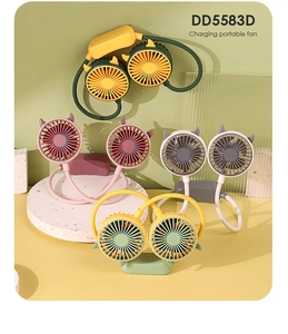 Detail view of colorful portable neck fans with devil horns on stone pedestal