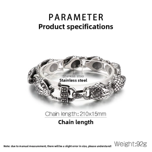 Macro detail of a 15mm men's stainless steel snake head bracelet with vintage finish