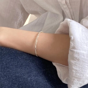 Minimalist 925 sterling silver beaded chain bracelet styled on a woman's wrist
