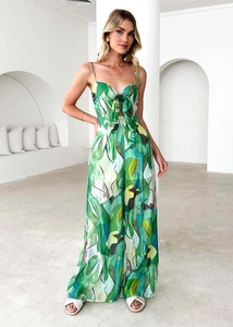 Detail of green floral jumpsuit featuring spaghetti straps and chest bow tie design