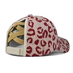 Detail view of the criss-cross elastic bands and leopard print on the baseball cap