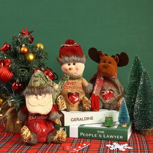 Three Christmas burlap gift bags featuring Santa, Snowman, and Reindeer with clear heart windows