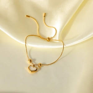 Adjustable 18K gold-plated heart bracelet with white shell inlay and sleek round beads