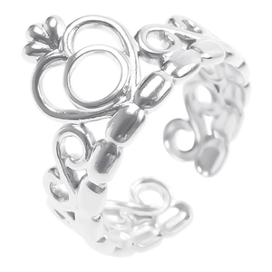 Detail of silver crown ring featuring intricate hollow-out patterns and adjustable open band