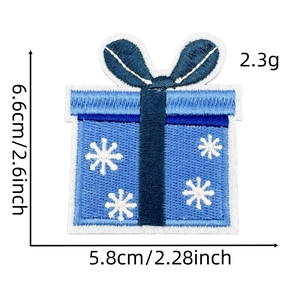 Detail view of blue gift box embroidery patch with snowflake pattern and exact dimensions