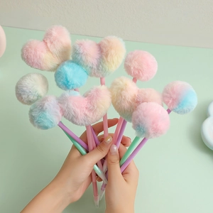 Close-up of cute macaron gradient heart-shaped plush ball pom-pom pens for students
