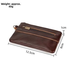 Detail view of brown leather coin pouch with dimensions 12.5x8cm and 40g weight label
