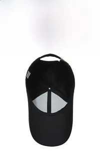 Close-up of black baseball cap interior showing breathable mesh lining and quality stitch