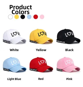 Detailed view of six colors of baseball caps with LOVE embroidery and ribbon straps
