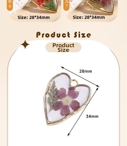 Detail view of heart-shaped resin charms with real purple flowers and 34mm size guide