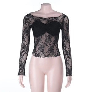 Detail of sheer black floral lace long sleeve crop top with sweetheart neckline lining