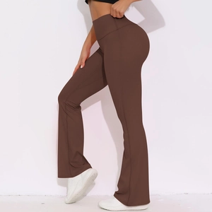 Macro detail of wide waistband on high-waist flared yoga pants in dark brown fabric