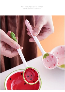 Detail of cute ceramic spoons in watermelon and strawberry shapes for creative dining ceremony