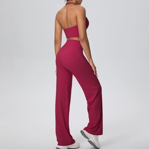 Detailed back view of a burgundy halter sports top and high-waisted wide-leg gym pants