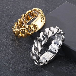 Detail of 22mm thick polished Cuban link bracelets in gold and silver stainless steel