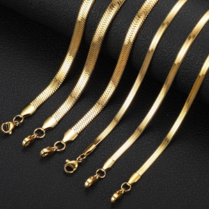 Flat gold snake bone chain necklaces in various widths on black leather background