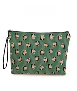 Detail of green canvas cosmetic bag with horse patterns and zipper closure