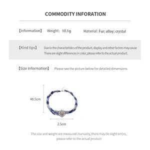 Guide des tailles montrant les dimensions du collier avec pendentif en fourrure et cristaux