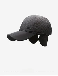 Detail of men's winter baseball cap with diamond quilting and foldable ear flaps in black