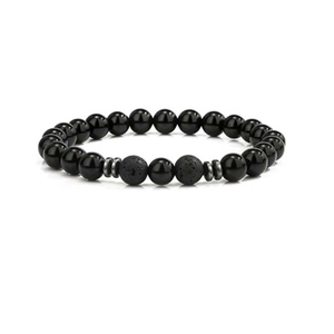 Detailed macro view of 8mm black obsidian and lava stone beads with metal spacers
