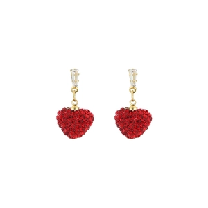 Detailed close-up of heart-shaped red crystal earrings with gold metallic settings