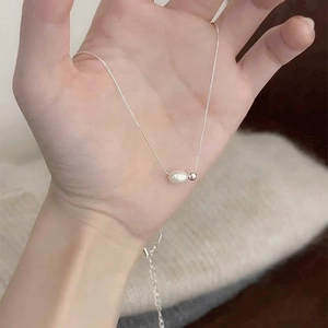 Handheld view of s925 sterling silver necklace featuring a baroque natural freshwater pearl