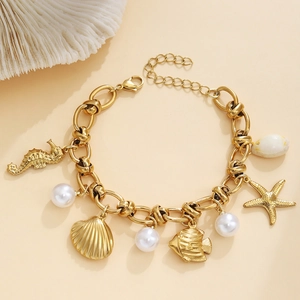 Bracelet océan en acier inoxydable doré avec breloques hippocampe et perles blanches