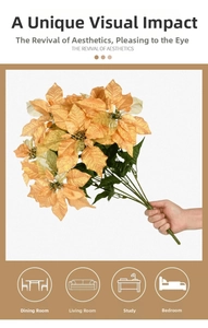 Detail of faux poinsettia stems in orange and yellow for living room and dining table decor