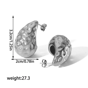 Detail of silver waterdrop earrings with hammered texture and 3.2cm height measurements