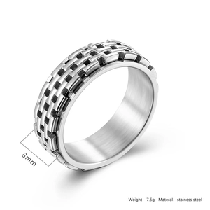 Detail shot of 8mm stainless steel spinner ring with industrial woven texture