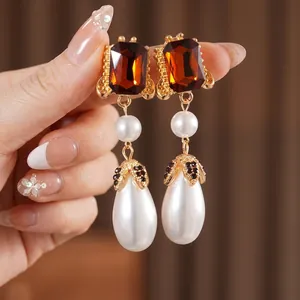 Vintage style drop earrings with amber square gems and large white pearl pendants