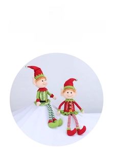 Detail of Christmas plush elves with sequined outfits and striped long legs for home decor