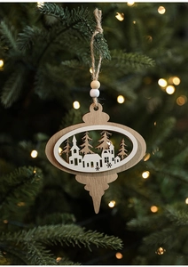 Detail of wooden Christmas ornament with laser-cut winter village and beaded rope