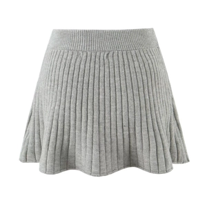 Detail of grey knitted high waist pleated skirt with ribbed texture and flare cut