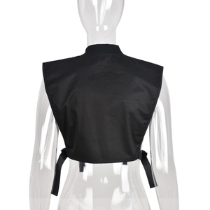 Rear view of black cropped tactical utility vest with adjustable buckle straps and high collar