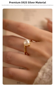 Detail view of S925 silver bamboo-style ring with a round white pearl on a finger