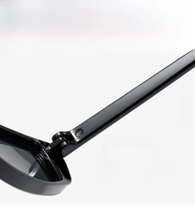 Detailed close-up showing the sturdy metal hinge design of these retro rectangular sunglasses