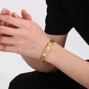 Men's punk wheat pattern braided chain bracelet in gold finish worn on wrist