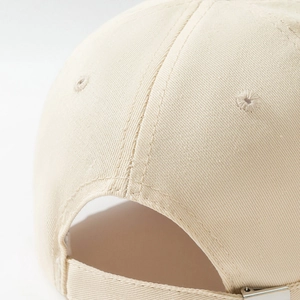 Detail view of cotton twill baseball cap with adjustable metal buckle and stitching