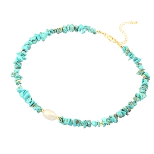 Bohemian turquoise stone necklace with baroque pearl and golden spacers on white background