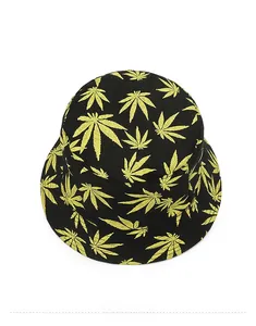 Top-down view of black tie-dye bucket hat with yellow maple leaf print pattern details