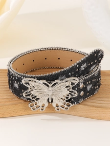 Detail of canvas belt with silver beads, rivets, and a hollow butterfly buckle