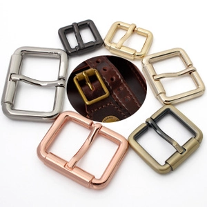 Detailed macro view of metal pin buckles in various colors and finishes for bag straps