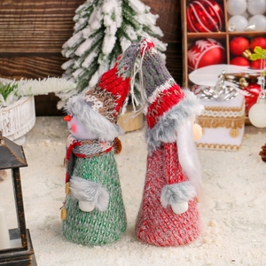 Set of 2 Christmas knitted gnome and snowman ornaments on decorative snow background